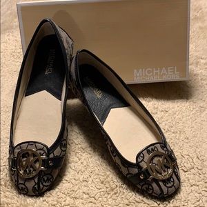 Black Michael Kors slip on shoes with rubber sole